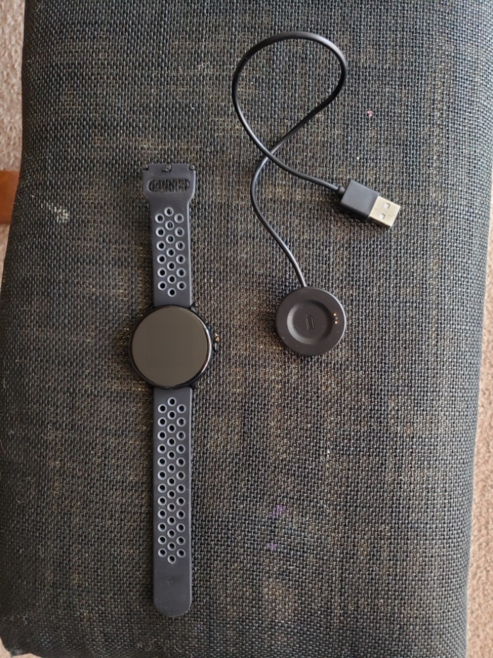 Black Round Smartwatch with USB Magnetic Charger and Sport Strap